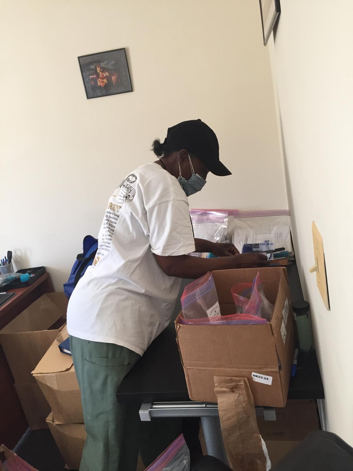 Volunteers preparing school supply donations